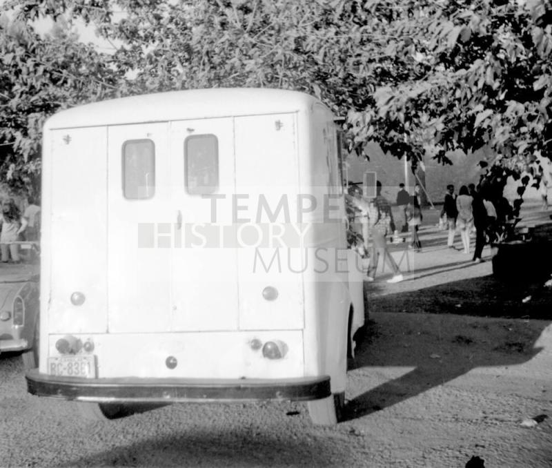 2 images, love-in, Tempe Beach Park--Rear of a truck/van; group of motorcycles