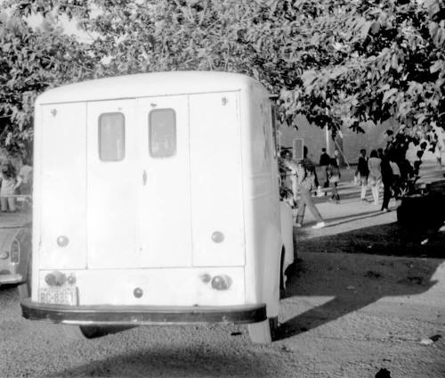 2 images, love-in, Tempe Beach Park--Rear of a truck/van; group of motorcycles