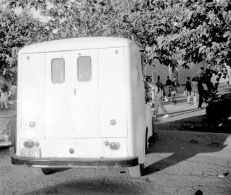 2 images, love-in, Tempe Beach Park--Rear of a truck/van; group of motorcycles