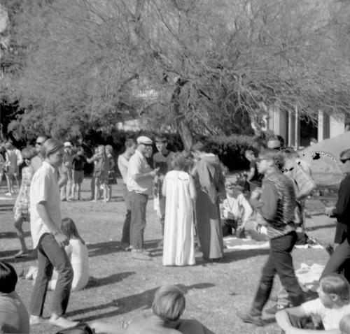 3 photographs, Love-In at Tempe Beach Park --2 of couple on lawn; standing crowd scene 2nd & 3rd photos now 2004.19.262 & 2004.19.263