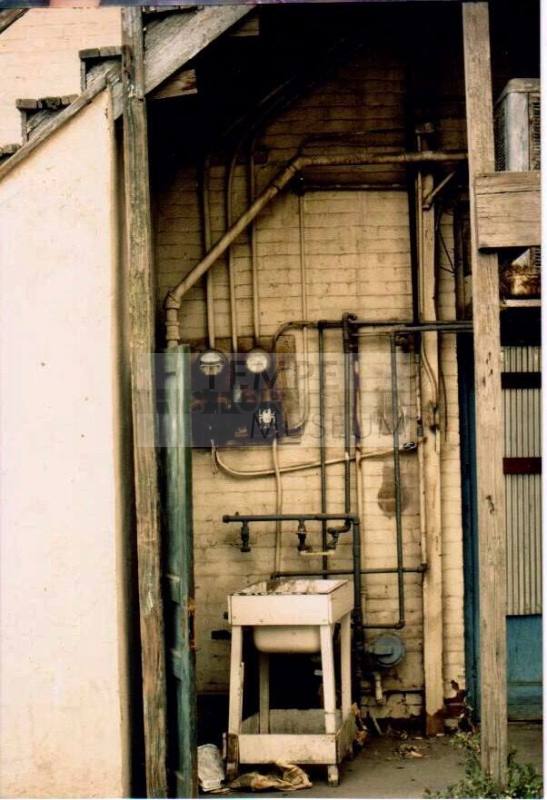 Rear of Building with Ellectrical Boxes, Conduits and Pipes
