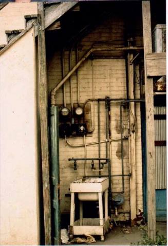Rear of Building with Ellectrical Boxes, Conduits and Pipes