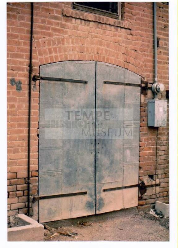Large Arched Double Delivery doors at Rear of Brick Building