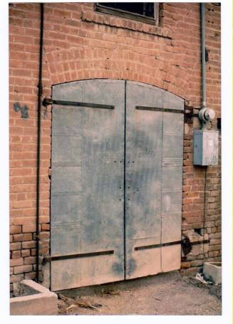 Large Arched Double Delivery doors at Rear of Brick Building