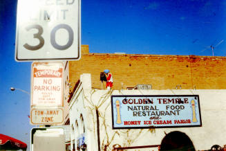 Photographer on Vienna Bakery building during 1976 Haydens Ferry Arts & Craft Fair
