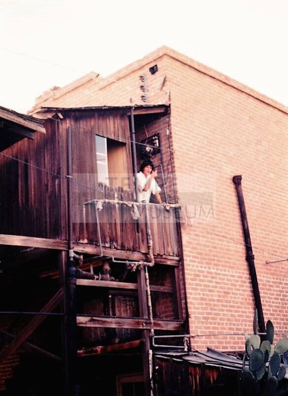 Person Smoking on Balcony