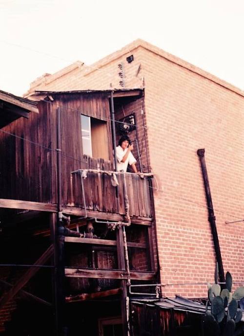 Person Smoking on Balcony