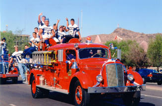 Tempe High School - Students Riding on Old Fire Truck during Parade