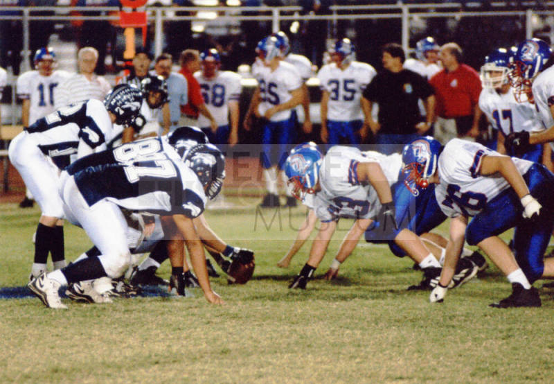 Tempe High School - Color photograph of Football Players Lined Up for a Down