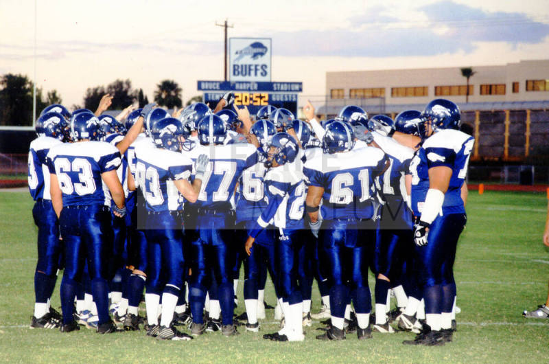 Tempe High School - Football Players Gathered  Around in a Circle