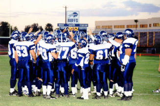 Tempe High School - Football Players Gathered  Around in a Circle