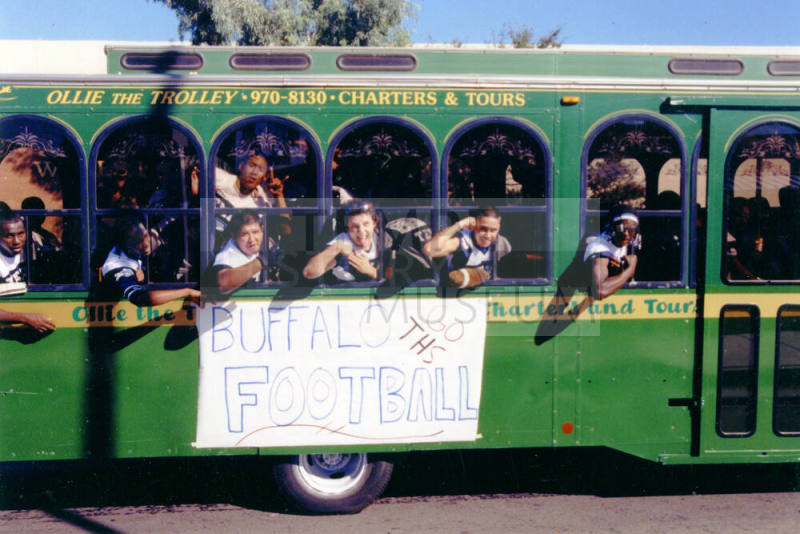 Tempe High School - Football Team Riding "Ollie the Trolley" at Parade