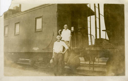Joe Rogers and Ralph Basset in Front of a Train.