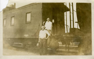Joe Rogers and Ralph Basset in Front of a Train.