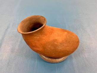 Ceramic Salado Red pottery, long boot shape