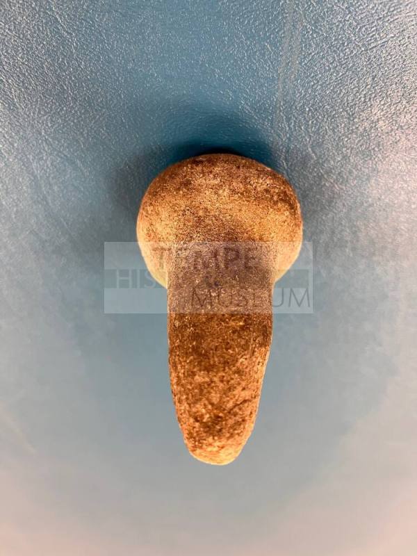 Ground stone pestle