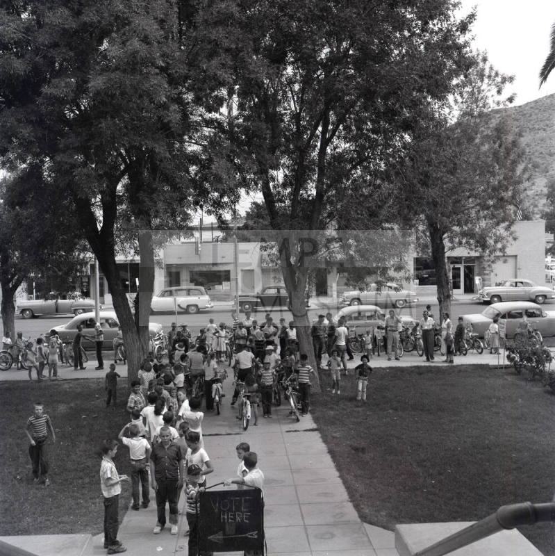 Adults and Children Standing Near a "Vote Here" Sign, Tempe City Hall