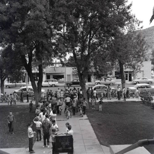 Adults and Children Standing Near a "Vote Here" Sign, Tempe City Hall