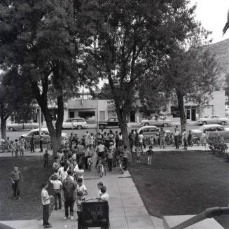 Adults and Children Standing Near a "Vote Here" Sign, Tempe City Hall