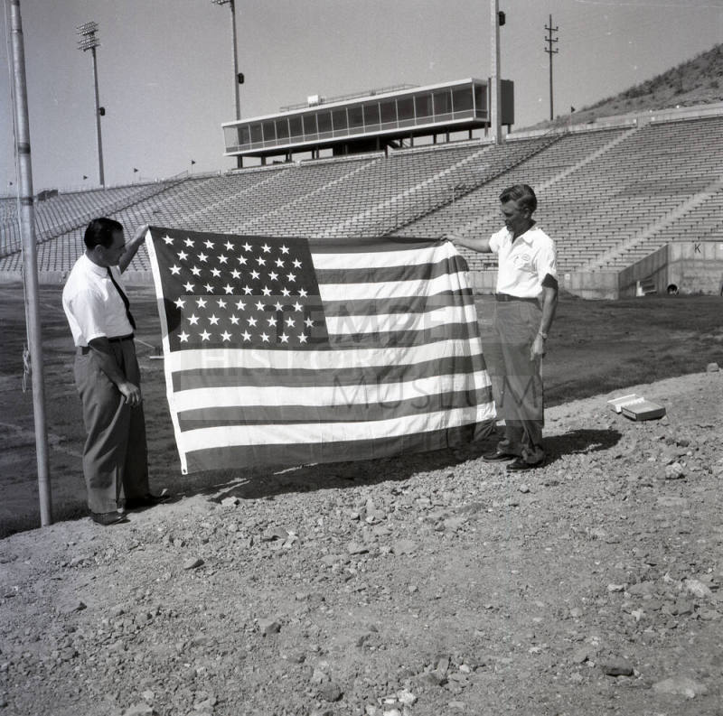 Two Men with an American Flag at Sun Devil Stadium