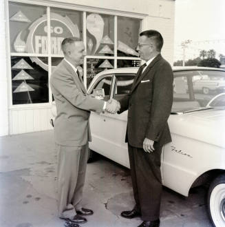 Richard Litz and Stanley Berge Shaking Hands