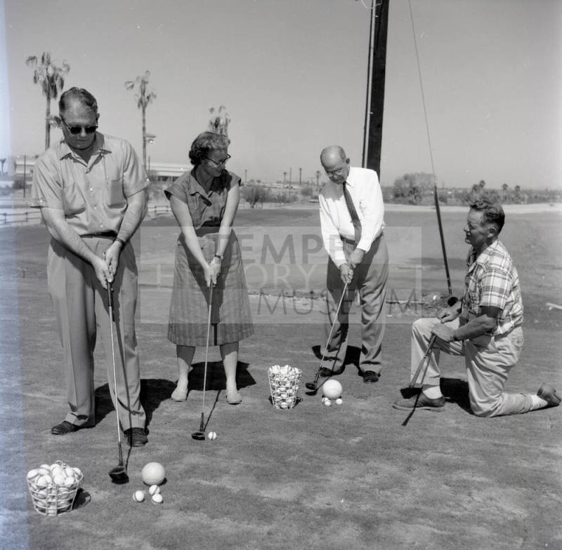 Golfers at Papa-Go Golf Course