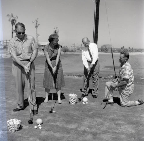 Golfers at Papa-Go Golf Course