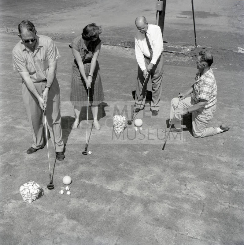 Golfers at Papa-Go Golf Course