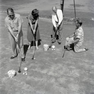 Golfers at Papa-Go Golf Course