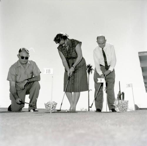 Golfers at Papa-Go Golf Course