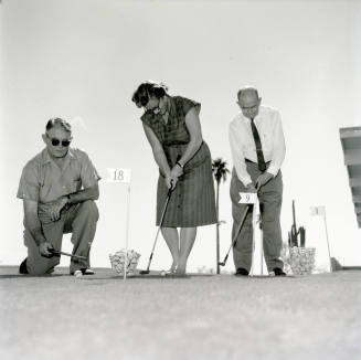 Golfers at Papa-Go Golf Course