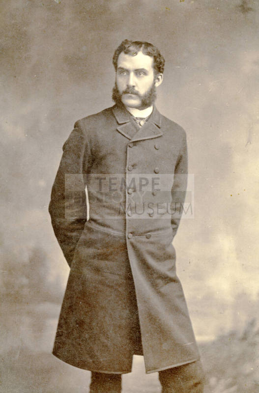 Full-length portrait of Dr. Fenn J Hart in Prince Albert suit