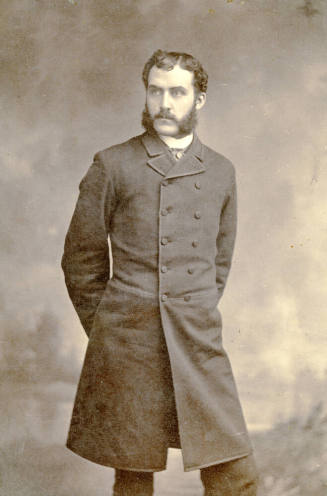 Full-length portrait of Dr. Fenn J Hart in Prince Albert suit