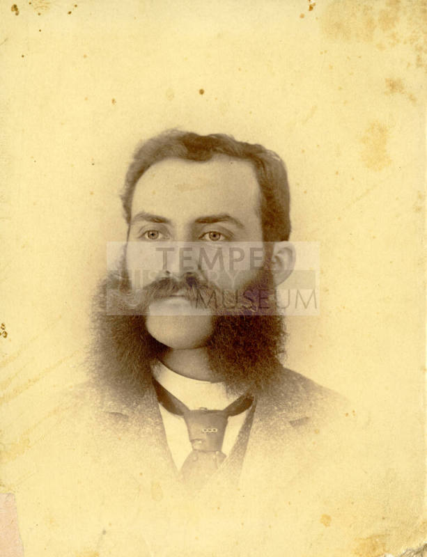 Individual portrait of Dr. Fenn J Hart with handlebar mustache and long sideburns