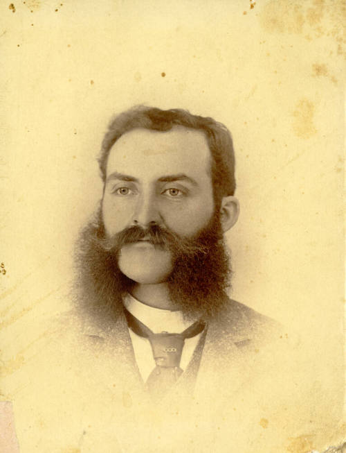 Individual portrait of Dr. Fenn J Hart with handlebar mustache and long sideburns