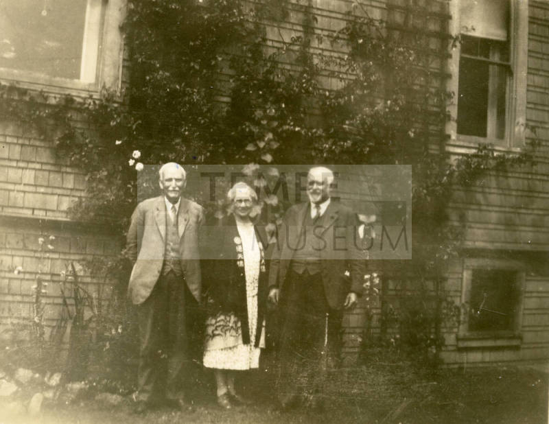 Group photo of Thomas Knight, Rosa Brown Hart and Dr. Fenn J Hart standing outside Mr. Knight's home in San Francisco.