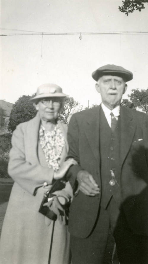Snapshot of Dr. Fenn J Hart, standing outside next to his wife at an unknown location