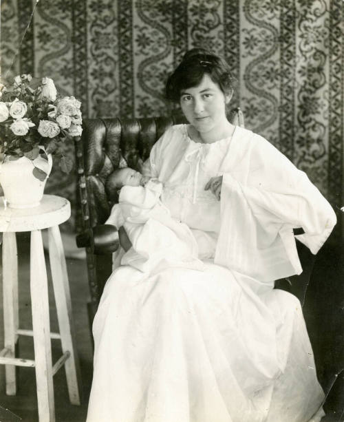 Portait of Mildred Hart Wilson holding a newborn Robert Hart Wilson