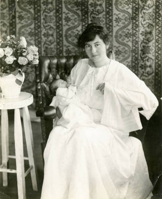 Portait of Mildred Hart Wilson holding a newborn Robert Hart Wilson