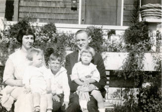 Family photo of Mildred Muriel Hart Wilson, daughter of Dr. Fenn J Hart, with her husband and children