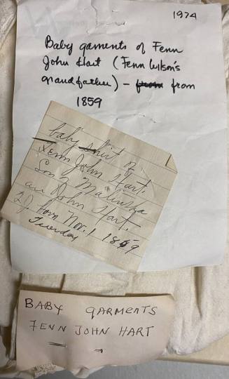 Notecards attached to the baby garments of Dr. Fenn J Hart