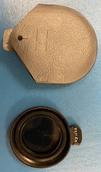 Light reducing lens