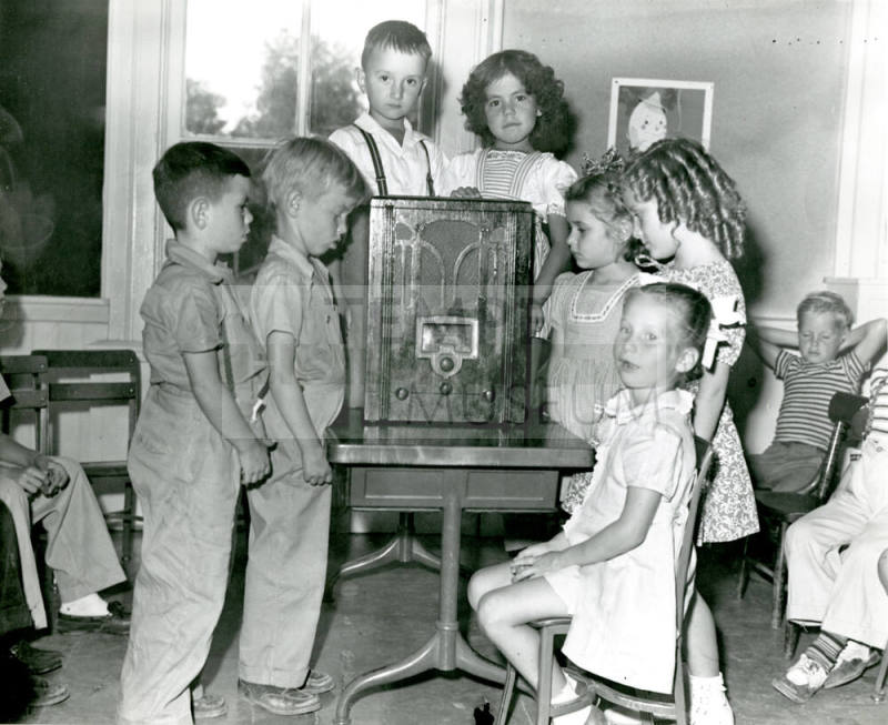 Children Listening to a Radio