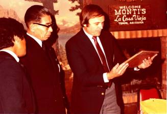 Shojiro Ozu and Harry Mitchell look at Monti's Plaque