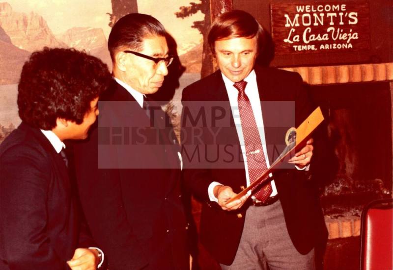 Shojiro Ozu and Harry Mitchell look at Monti's Envelope
