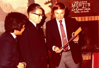 Shojiro Ozu and Harry Mitchell look at Monti's Envelope
