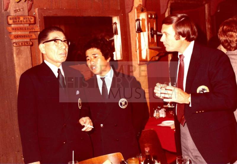 President Shojiro Ozu and Harry Mitchell talk inside Monti's