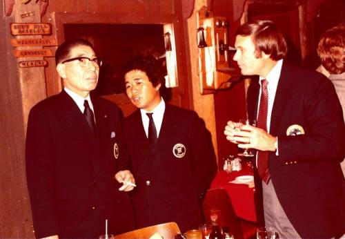 President Shojiro Ozu and Harry Mitchell talk inside Monti's