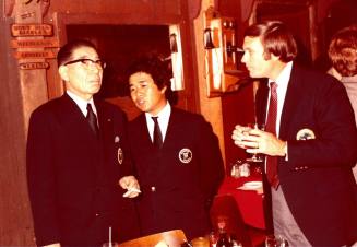 President Shojiro Ozu and Harry Mitchell talk inside Monti's