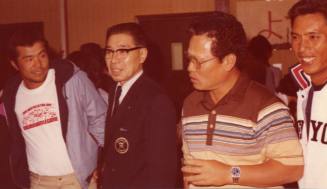 Shojiro Ozu standing alongisde Team Members at Monti's